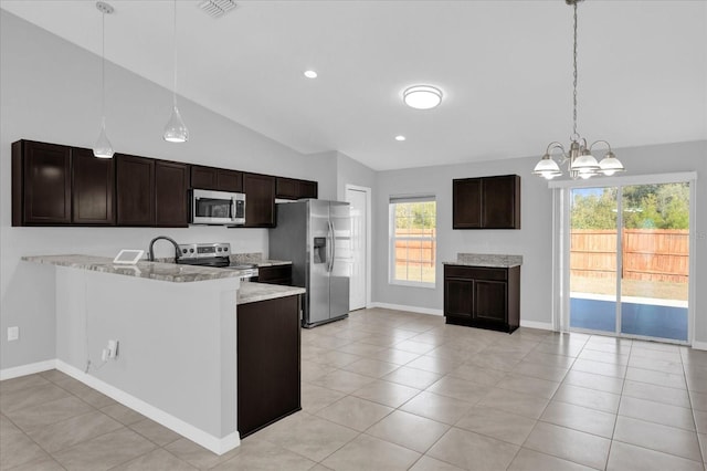 kitchen featuring light tile patterned flooring, appliances with stainless steel finishes, pendant lighting, kitchen peninsula, and dark brown cabinets