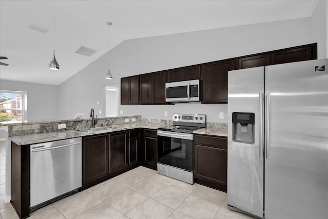 kitchen with pendant lighting, sink, appliances with stainless steel finishes, dark brown cabinets, and kitchen peninsula