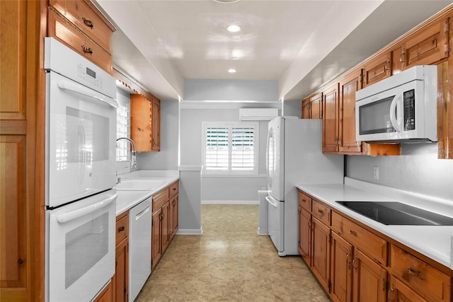 625 Brechin Dr, Winter Park, FL 32792 - kitchen featuring white appliances, a sink, and brown cabinets