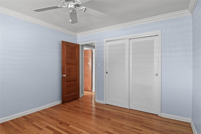 625 Brechin Dr, Winter Park, FL 32792 - unfurnished bedroom with crown molding, light wood-style floors, baseboards, and a closet