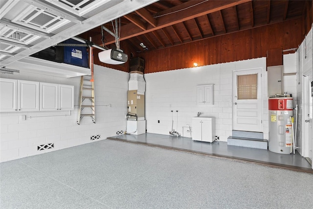 625 Brechin Dr, Winter Park, FL 32792 - garage with water heater, a garage door opener, wooden ceiling, and heating unit