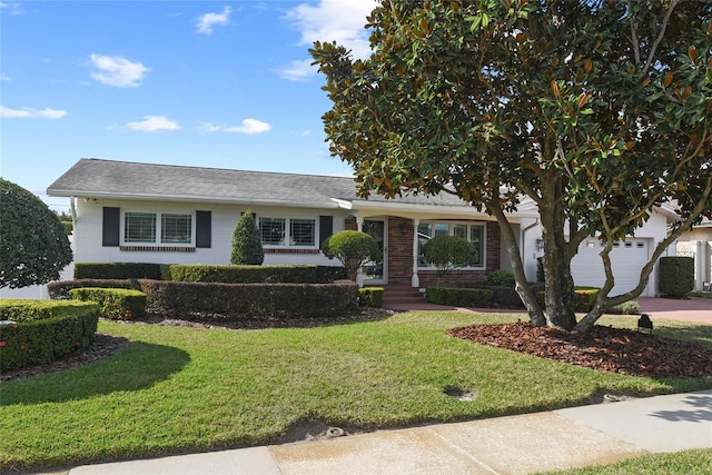 625 Brechin Dr, Winter Park, FL 32792 - view of front of house with a front yard, an attached garage, driveway, and a shingled roof