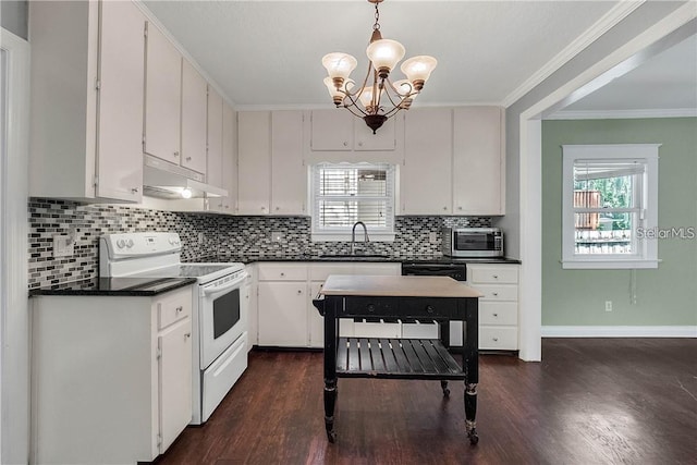 kitchen with white electric stove, white cabinetry, hanging light fixtures, and sink