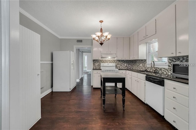 kitchen with dark wood-type flooring, sink, white cabinetry, pendant lighting, and white appliances