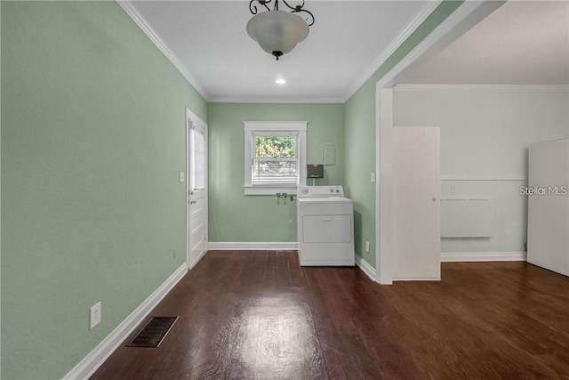 washroom featuring crown molding, washer / dryer, and dark hardwood / wood-style flooring