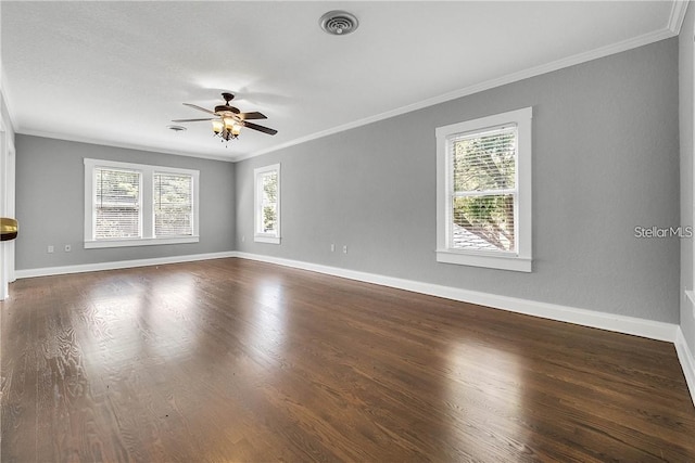 spare room featuring crown molding, ceiling fan, and dark hardwood / wood-style flooring