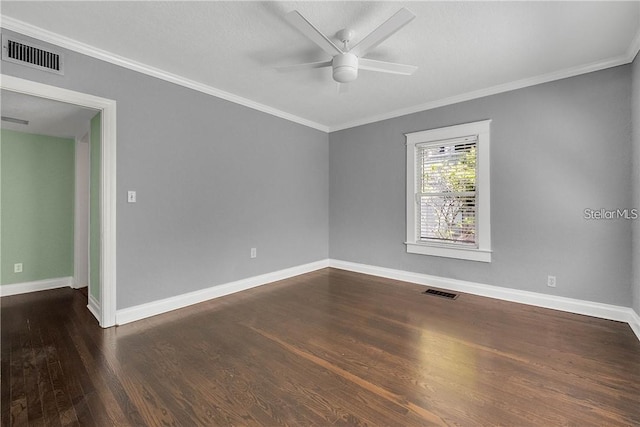 spare room featuring ornamental molding, dark hardwood / wood-style floors, and ceiling fan