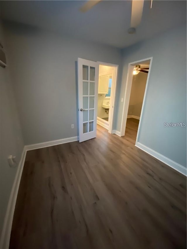 empty room featuring wood-type flooring and ceiling fan