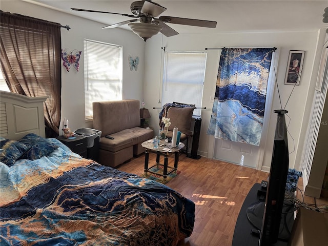 bedroom featuring hardwood / wood-style flooring and ceiling fan