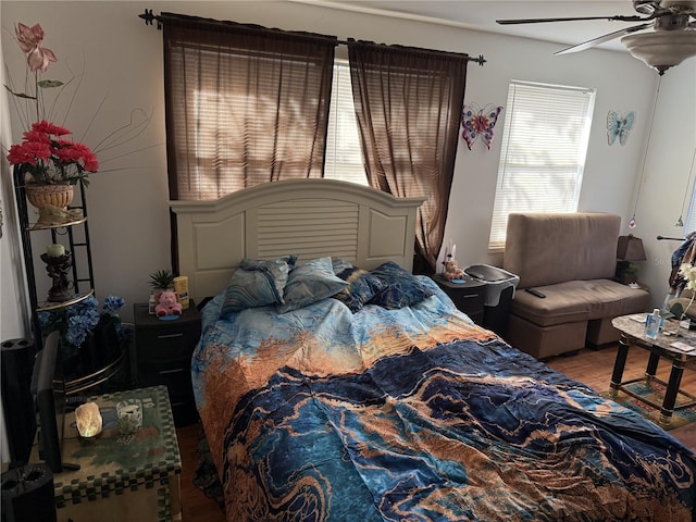 bedroom featuring hardwood / wood-style flooring and ceiling fan