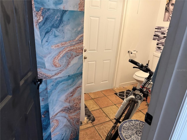 bathroom with tile patterned flooring and toilet