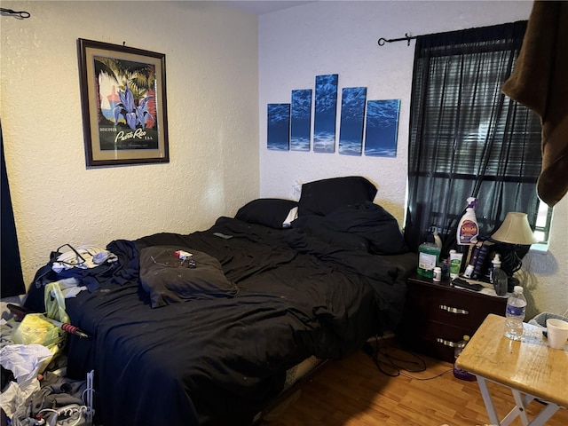 bedroom featuring hardwood / wood-style flooring