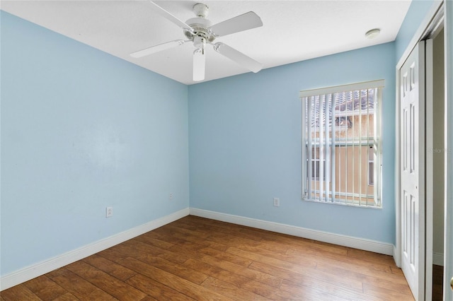 unfurnished room featuring hardwood / wood-style floors and ceiling fan