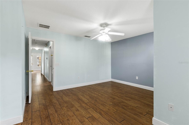 unfurnished room with dark hardwood / wood-style floors and ceiling fan