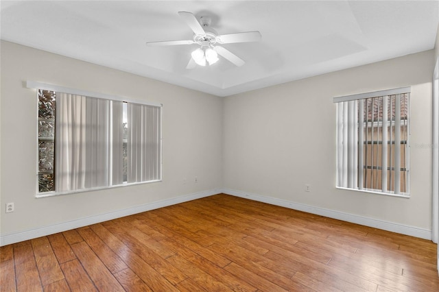 unfurnished room with ceiling fan and light wood-type flooring