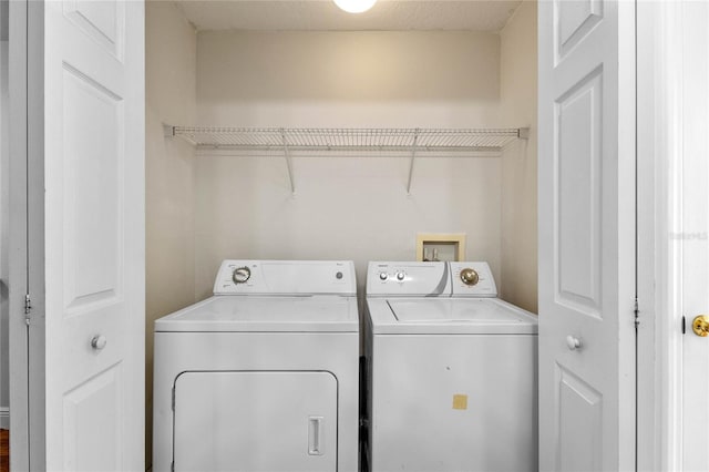 washroom with independent washer and dryer