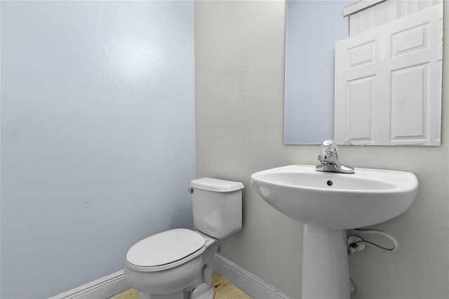 bathroom featuring toilet