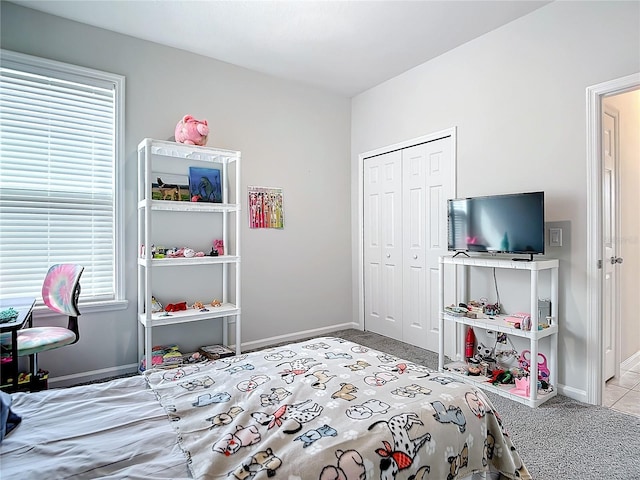 carpeted bedroom with a closet