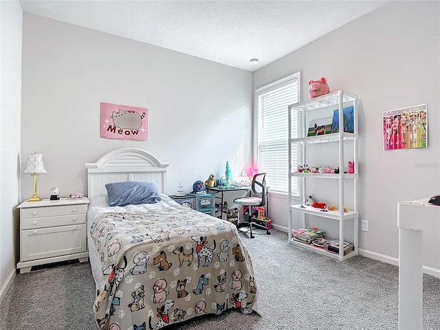 bedroom featuring multiple windows and dark colored carpet