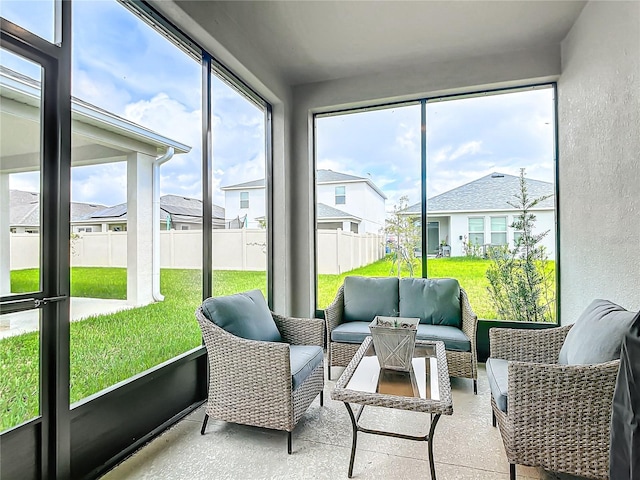 sunroom / solarium featuring plenty of natural light