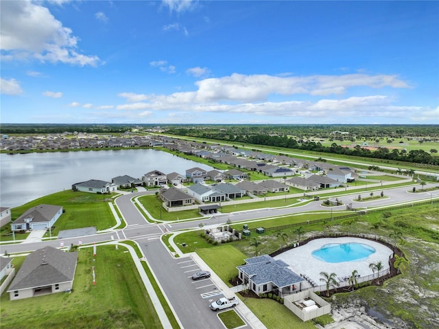 birds eye view of property with a water view