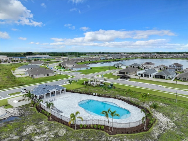 view of swimming pool with a water view