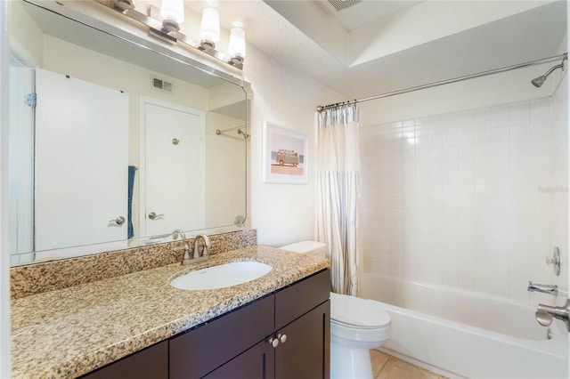 full bathroom with shower / bath combo, vanity, tile patterned floors, and toilet