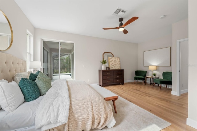 bedroom featuring light wood-type flooring, ceiling fan, and access to outside