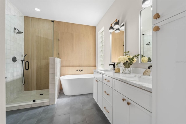 bathroom with shower with separate bathtub, tile patterned flooring, and vanity