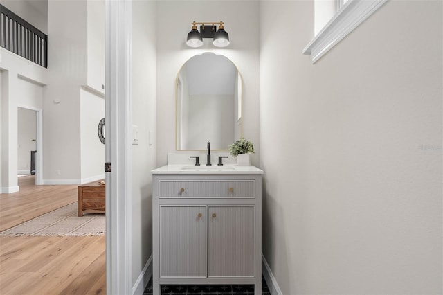 bathroom with vanity and hardwood / wood-style floors