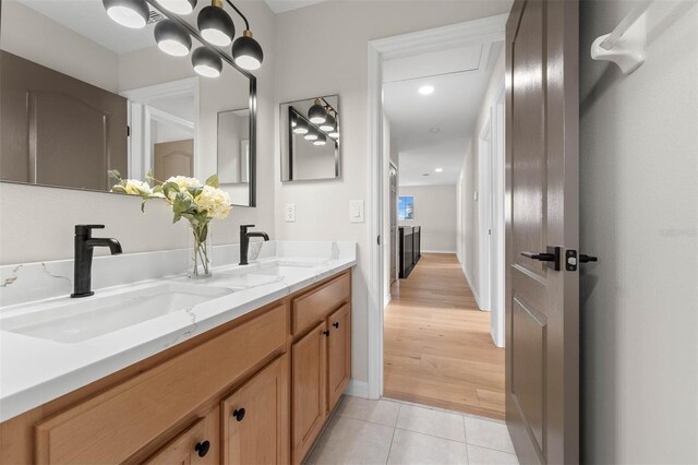 bathroom featuring tile patterned flooring and vanity