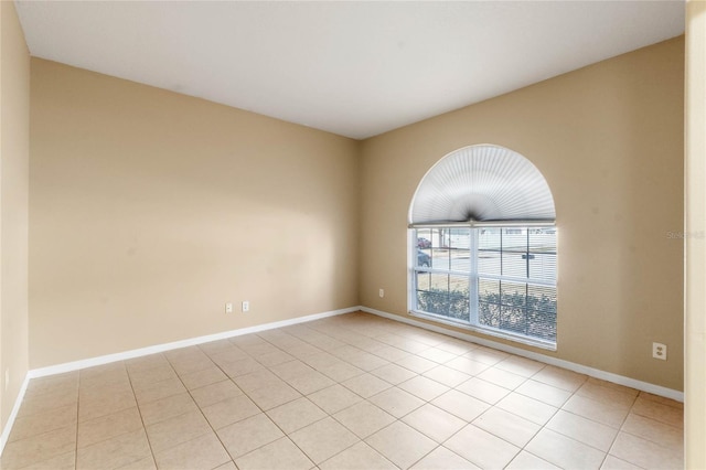 unfurnished room with light tile patterned floors