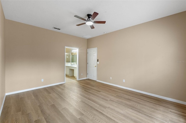 unfurnished room with ceiling fan and light hardwood / wood-style floors