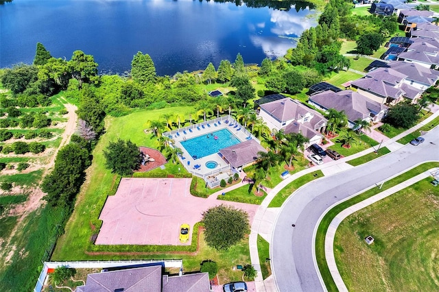 birds eye view of property with a water view