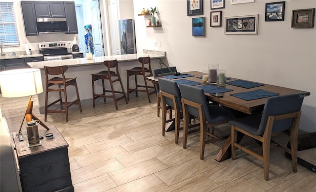 dining room featuring sink