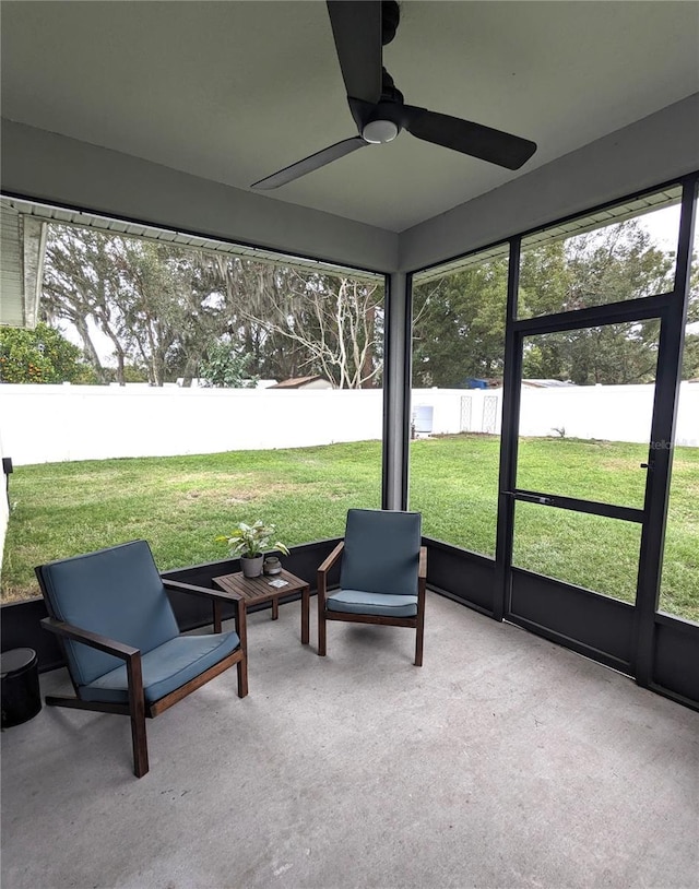 sunroom / solarium with ceiling fan