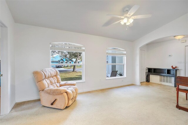 sitting room with carpet floors, ceiling fan, and baseboards