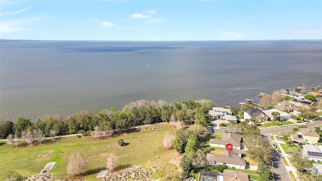 birds eye view of property with a water view and a residential view