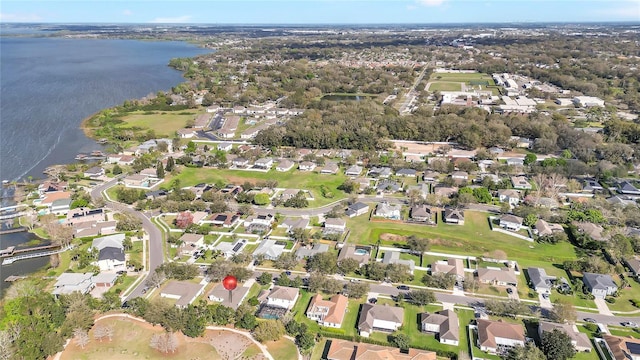 bird's eye view featuring a residential view and a water view