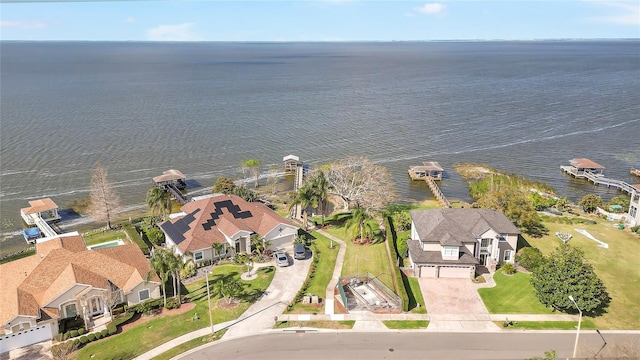 birds eye view of property featuring a residential view and a water view