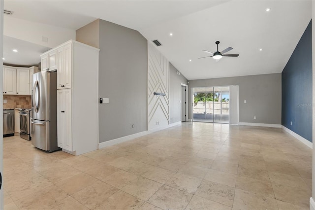 unfurnished living room with vaulted ceiling, baseboards, visible vents, and ceiling fan