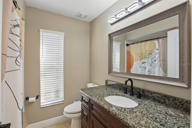 full bath featuring vanity, baseboards, visible vents, tile patterned flooring, and toilet