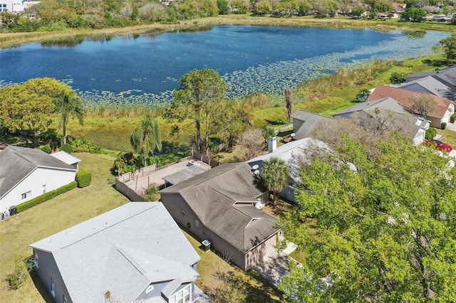 birds eye view of property with a water view and a residential view