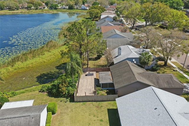 drone / aerial view with a residential view and a water view