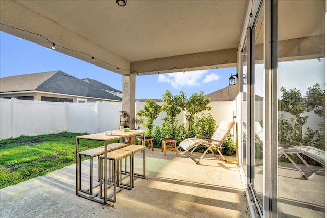 view of patio / terrace with outdoor dining space and a fenced backyard