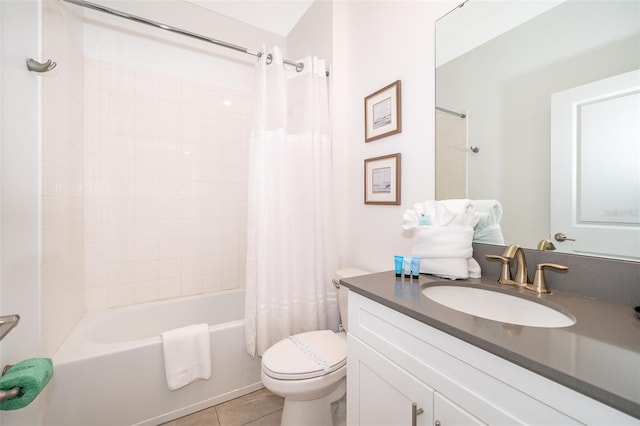 full bathroom with shower / tub combo with curtain, vanity, tile patterned flooring, and toilet