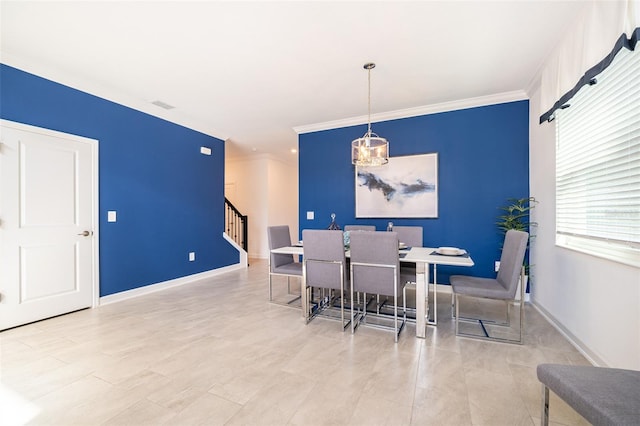 dining room featuring ornamental molding