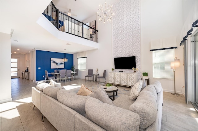 living room featuring a high ceiling and a notable chandelier