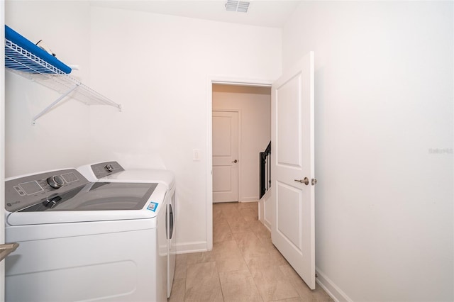 washroom featuring washer and dryer