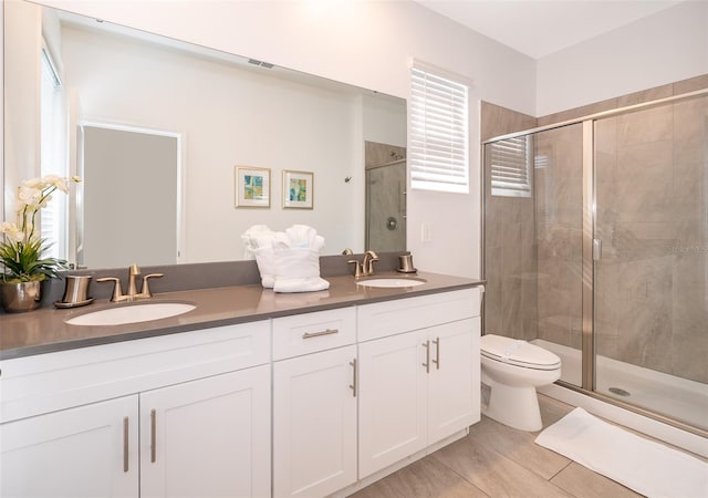 bathroom featuring vanity, hardwood / wood-style flooring, and walk in shower